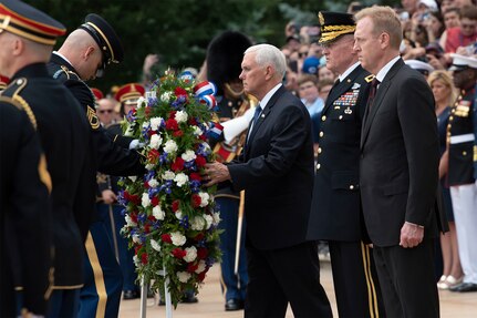 Vice President Mike Pence lays a wreath at the Tomb of the Unknown Soldier with Acting Defense Secretary Patrick M. Shanahan and Army Maj. Gen. Michael L. Howard at Arlington National Cemetery, Va., May 27, 2019.