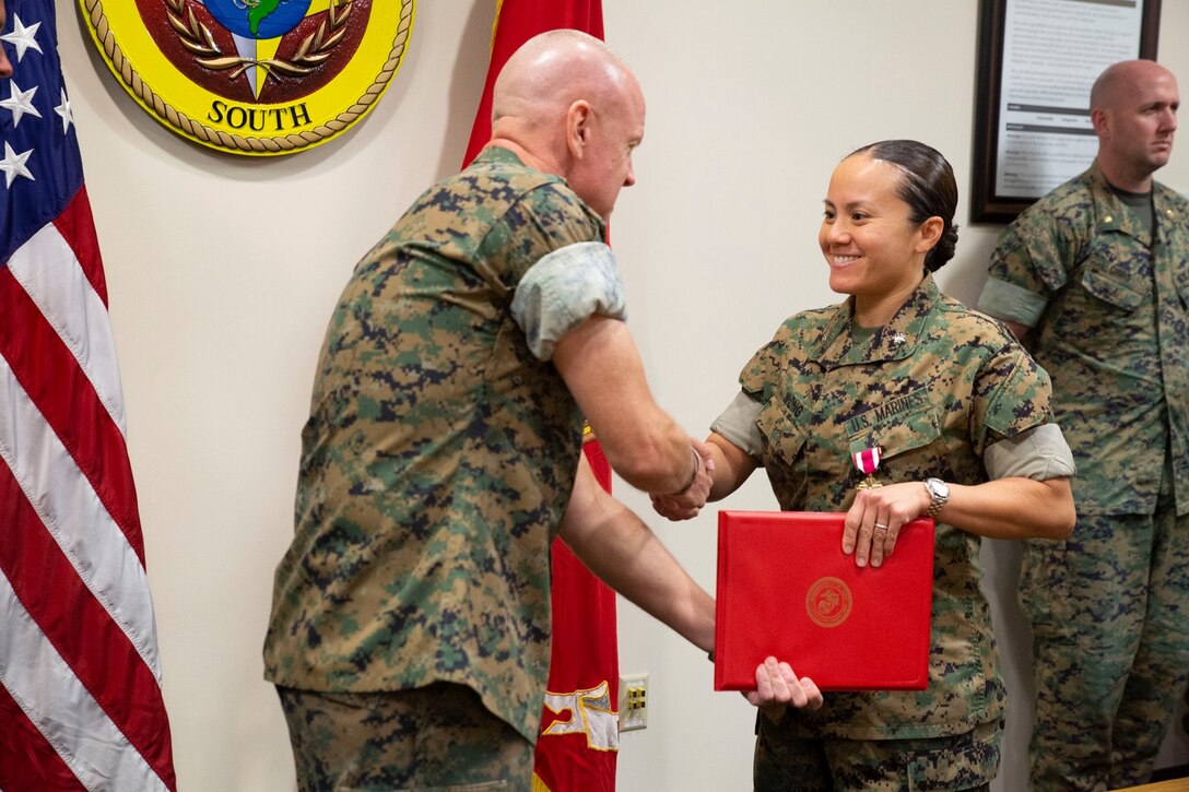 U.S. Marine Corps Forces, South awards LtCol Maisie M. Wong the Meritorious Service Medal as her tour in Miami comes to an end, May 7, 2019.