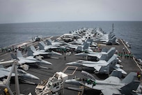 Sailors partake in a foreign object and debris walk-down on the flight deck of the Nimitz-class aircraft carrier USS Abraham Lincoln in the Arabian Sea, May 10, 2019. Abraham Lincoln Carrier Strike Group 12 is deployed to the U.S. 5th Fleet area of operations.