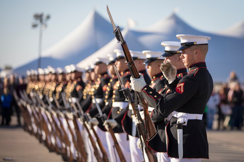 U.S. Marines assigned to the Battle Color Detachment, perform at the 2019 Yuma Twilight Show hosted by Marine Corps Air Station Yuma Ariz., March 9, 2019. The airshow is MCAS Yuma's only military airshow of the year and provides the community an opportunity to see thrilling aerial and ground performers for free while interacting with Marines and Sailors. (U.S. Marine Corps photo by Sgt. Allison Lotz)
