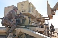 Army Spc. Tevin Howe, Bravo Battery, 1st Battalion, 43rd Air Defense Artillery Regiment Patriot launcher enhanced operator and maintainer crew member, signals for reload during training in the U.S. Central Command area of operations, Jan. 12, 2019.