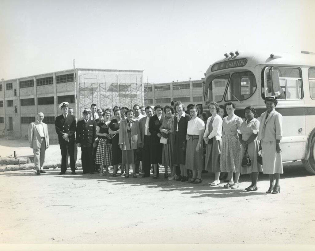 Employees from Arlington Hall Station on a visit to the site of the new NSA, the William and Elizebeth Friedman Operations Building (Operations Building 1) is in the background