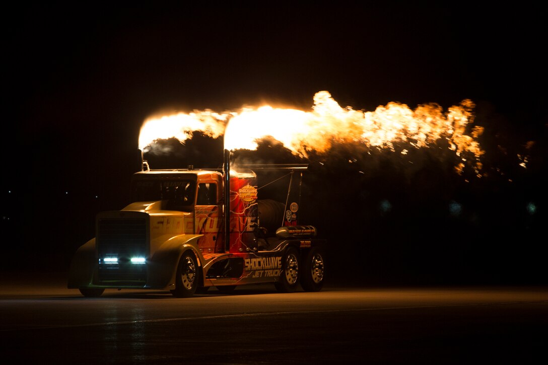 Chris Darnell, driver of the Shockwave Jet Truck, drives down the Marine Corps Air Station(MCAS) Yuma, Ariz., flight line during the 2019 Yuma Airshow March 8, 2019. The Flash Fire Jet Trucks are the world's fastest jet-powered trucks achieving a record 375 miles per hour. The airshow is MCAS Yuma's only military airshow of the year and provides the community an opportunity to see thrilling aerial and ground performers for free while interacting with Marines and Sailors. (U.S. Marine Corps photo ny Pfc. Hall)