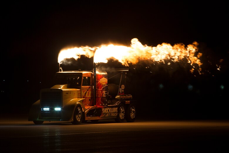 Chris Darnell, driver of the Shockwave Jet Truck, drives down the Marine Corps Air Station(MCAS) Yuma, Ariz., flight line during the 2019 Yuma Airshow March 8, 2019. The Flash Fire Jet Trucks are the world's fastest jet-powered trucks achieving a record 375 miles per hour. The airshow is MCAS Yuma's only military airshow of the year and provides the community an opportunity to see thrilling aerial and ground performers for free while interacting with Marines and Sailors. (U.S. Marine Corps photo ny Pfc. Hall)