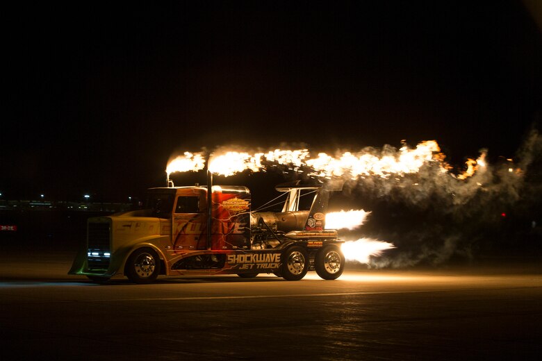 Chris Darnell, driver of the Shockwave Jet Truck, drives down the Marine Corps Air Station(MCAS) Yuma, Ariz., flight line during the 2019 Yuma Airshow March 8, 2019. The Flash Fire Jet Trucks are the world's fastest jet-powered trucks achieving a record 375 miles per hour. The airshow is MCAS Yuma's only military airshow of the year and provides the community an opportunity to see thrilling aerial and ground performers for free while interacting with Marines and Sailors. (U.S. Marine Corps photo ny Pfc. Hall)