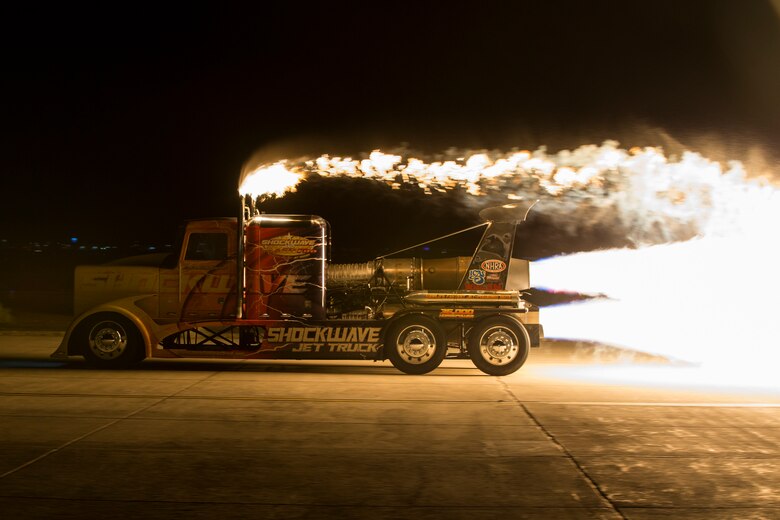 Chris Darnell, driver of the Shockwave Jet Truck, drives down the Marine Corps Air Station(MCAS) Yuma, Ariz., flight line during the 2019 Yuma Airshow March 8, 2019. The Flash Fire Jet Trucks are the world's fastest jet-powered trucks achieving a record 375 miles per hour. The airshow is MCAS Yuma's only military airshow of the year and provides the community an opportunity to see thrilling aerial and ground performers for free while interacting with Marines and Sailors. (U.S. Marine Corps photo ny Pfc. Hall)