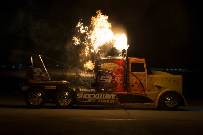 Chris Darnell, driver of the Shockwave Jet Truck, drives down the Marine Corps Air Station(MCAS) Yuma, Ariz., flight line during the 2019 Yuma Airshow March 8, 2019. The Flash Fire Jet Trucks are the world's fastest jet-powered trucks achieving a record 375 miles per hour. The airshow is MCAS Yuma's only military airshow of the year and provides the community an opportunity to see thrilling aerial and ground performers for free while interacting with Marines and Sailors. (U.S. Marine Corps photo by Pfc. Hall)