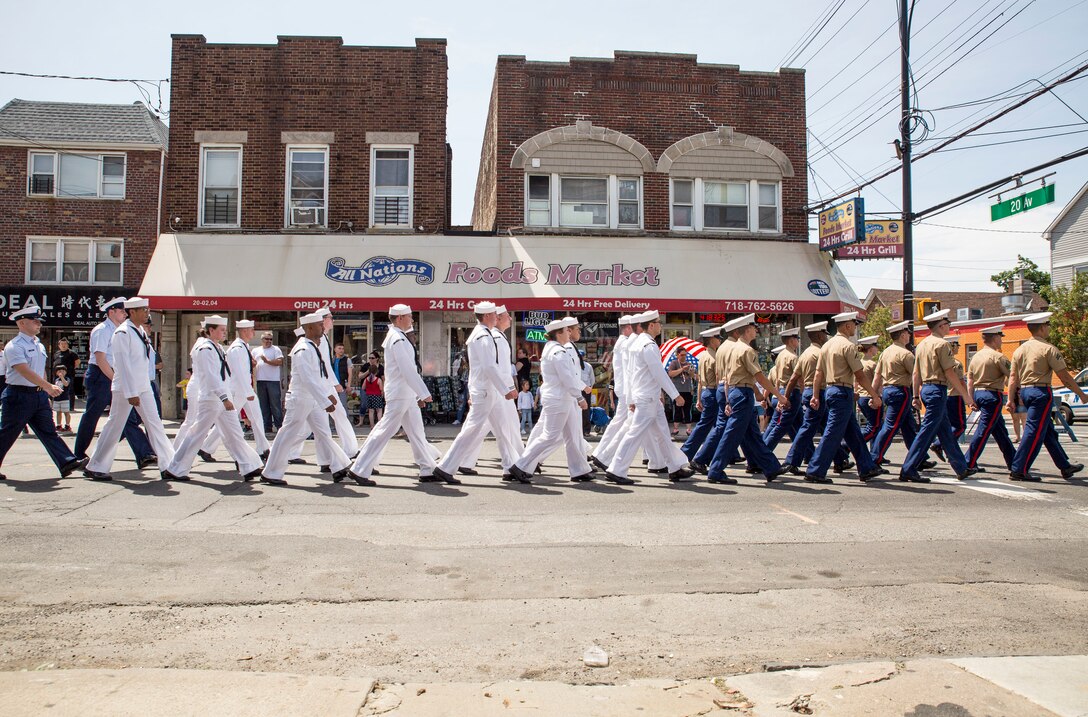 U.S. Marines, sailors, and Coast Guard members march in a Memorial Day parade as part of Fleet Week New York (FWNY), in Queens, N.Y., May 26, 2019. FWNY is an opportunity for the citizens of New York City and the surrounding tristate area to come together with the nation’s sea services through community engagement to gain a better understanding of how the sea services support the national defense of the United States. (U.S. Marine Corps photo by Cpl. Tojyea G. Matally)