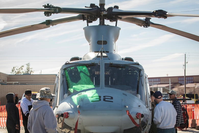 Visitors and spectators from around the world view static displays of aircraft at the 2019 Yuma Airhow hosted by Marine Corps Air Station (MCAS) Yuma Ariz., March 9, 2019. The airshow is MCAS Yuma's only military airshow of the year and provides the community an opportunity to see thrilling aerial and ground performers for free while interacting with Marines and Sailors. (U.S. Marine Corps photo by Sgt. Allison Lotz)