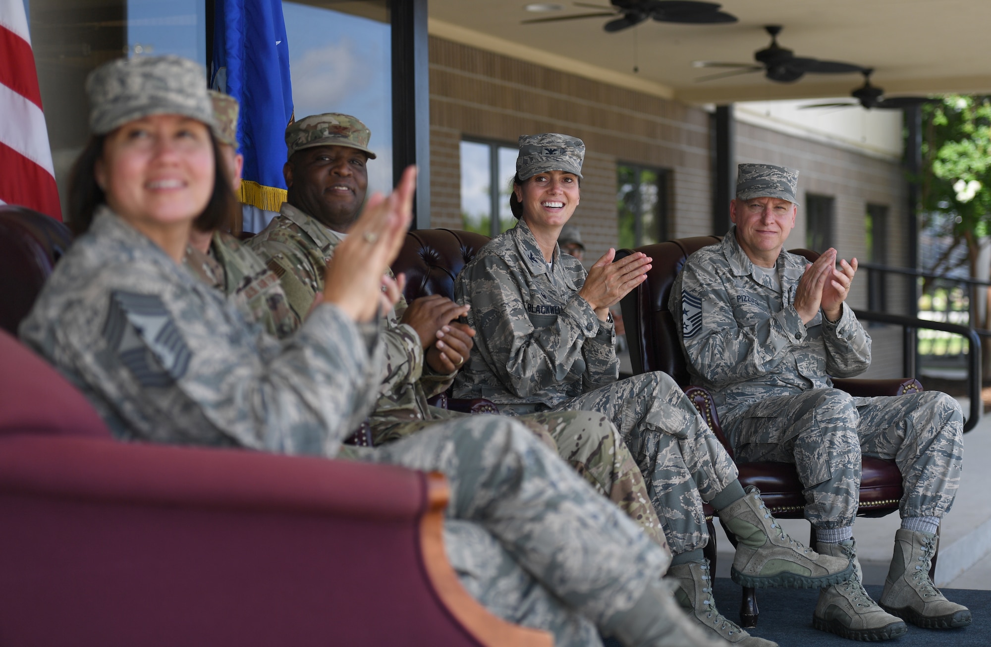 Keesler leadership applauds during a drill performance at the Levitow Training Support Facility drill pad on Keesler Air Force Base, Mississippi, May 21, 2019. The Keesler drill teams, made up of Airmen from various squadrons within the 81st Training Group, debuted their performances in front of base leadership and their peers. Every year, both the regulation and freestyle teams compete at Lackland Air Force Base, Texas, for "Best Technical Training Drill Team of the Year." However, this year it was cancelled due to inclement weather. (U.S. Air Force photo by Kemberly Groue)