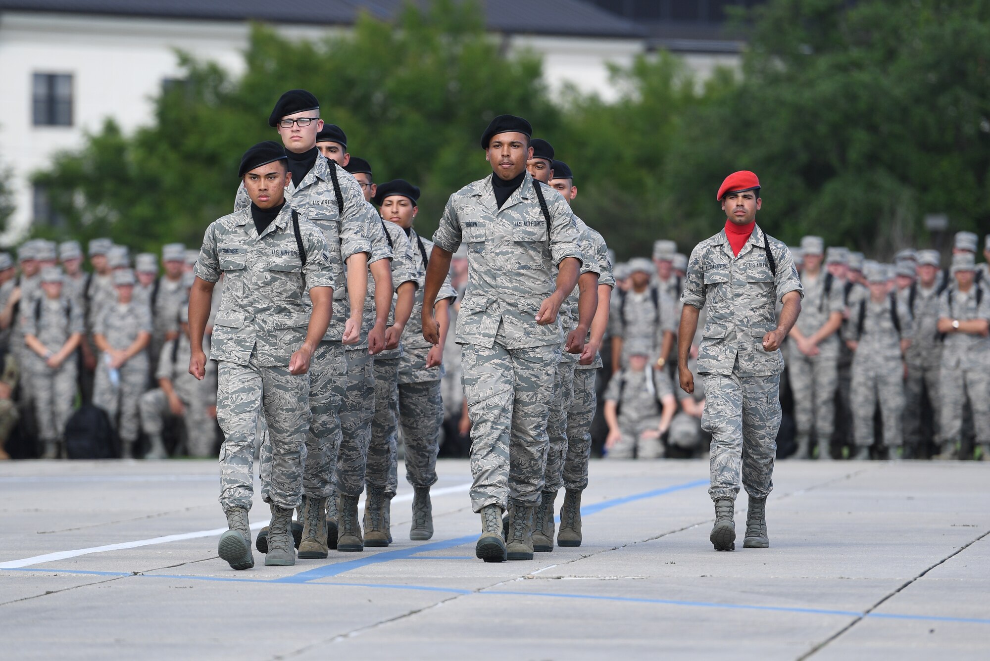 The Keesler Air Force Base regulation drill team performs their routine at the Levitow Training Support Facility drill pad on Keesler Air Force Base, Mississippi, May 21, 2019. The drill teams, made up of Airmen from various squadrons within the 81st Training Group, debuted their performances in front of base leadership and their peers. Every year both the regulation and freestyle teams compete at Lackland Air Force Base, Texas, for "Best Technical Training Drill Team of the Year." However, this year it was cancelled due to inclement weather. (U.S. Air Force photo by Kemberly Groue)