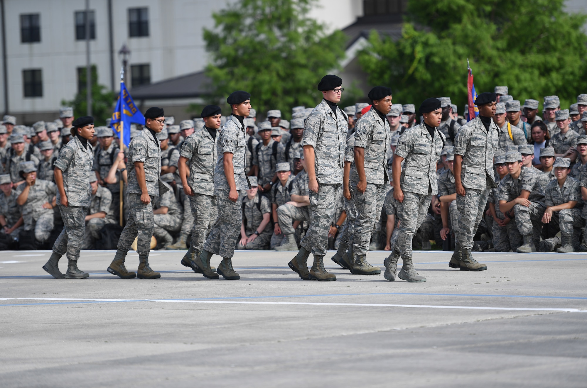 The Keesler Air Force Base regulation drill team performs their routine at the Levitow Training Support Facility drill pad on Keesler Air Force Base, Mississippi, May 21, 2019. The drill teams, made up of Airmen from various squadrons within the 81st Training Group, debuted their performances in front of base leadership and their peers. Every year both the regulation and freestyle teams compete at Lackland Air Force Base, Texas, for "Best Technical Training Drill Team of the Year." However, this year it was cancelled due to inclement weather. (U.S. Air Force photo by Kemberly Groue)