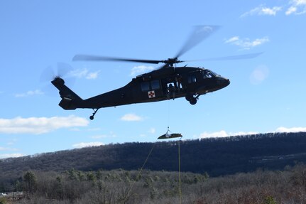 FORT INDIANTOWN GAP, Pa.-Soldiers training at the Pennsylvania National Guard’s Medical Battalion Training Site’s 68W requalification course medevac a simulated casualty during their capstone exercise Feb. 26. (U.S. Army National Guard photo by Maj. Angela King-Sweigart\Released)