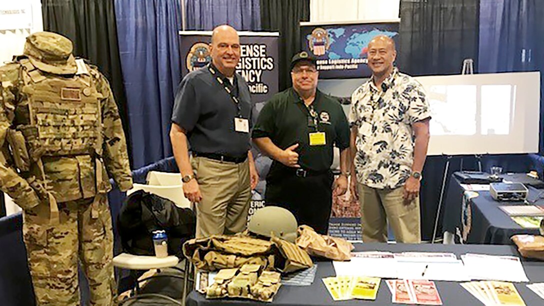 DLA Acquisition Director Matthew Beebe (left) poses for a photo at the 2019 AUSA LANPAC Symposium and Exposition in Honolulu May 21-23 with Steve Dirico and Geoff Ellazar
