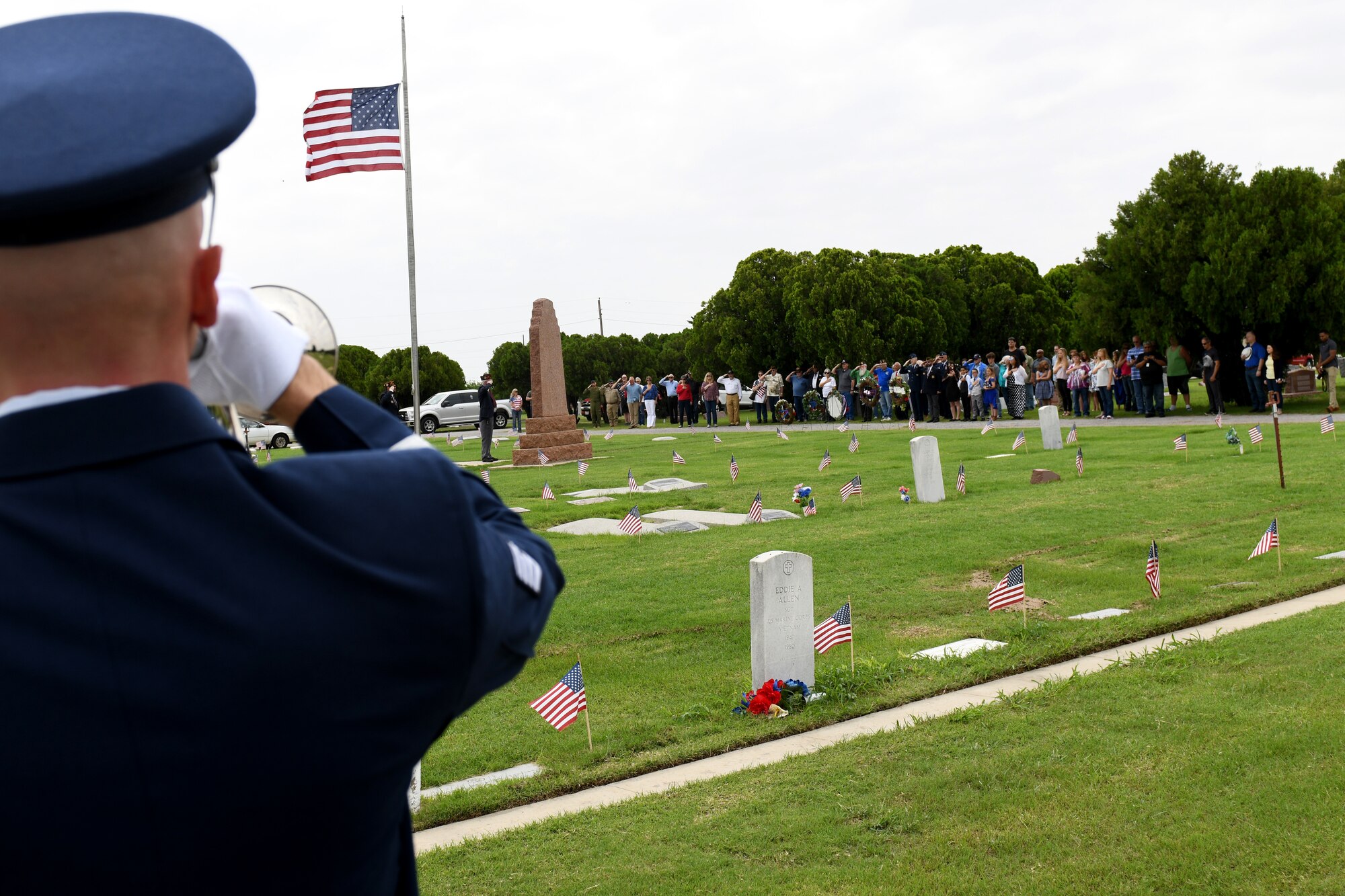 Tech. Sgt. Jedidiah Coover, NCO in charge of Honor Guard assigned to the 97th Force Support Squadron, plays Taps during a Memorial Day Ceremony, May 27, 2019, at Altus, Okla. Taps is a song that signifies respect for fallen service members who gave the ultimate sacrifice for their country.
