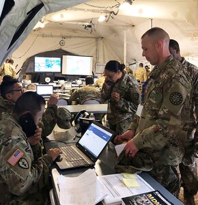 Soldiers of the 369th Sustainment Brigade man their command post on May 12, 2019 during exercise Guardian Response 19 at Camp Atterbury, Indiana. One hundred and sixty New York National Guard Soldiers took part in the major national exercise.