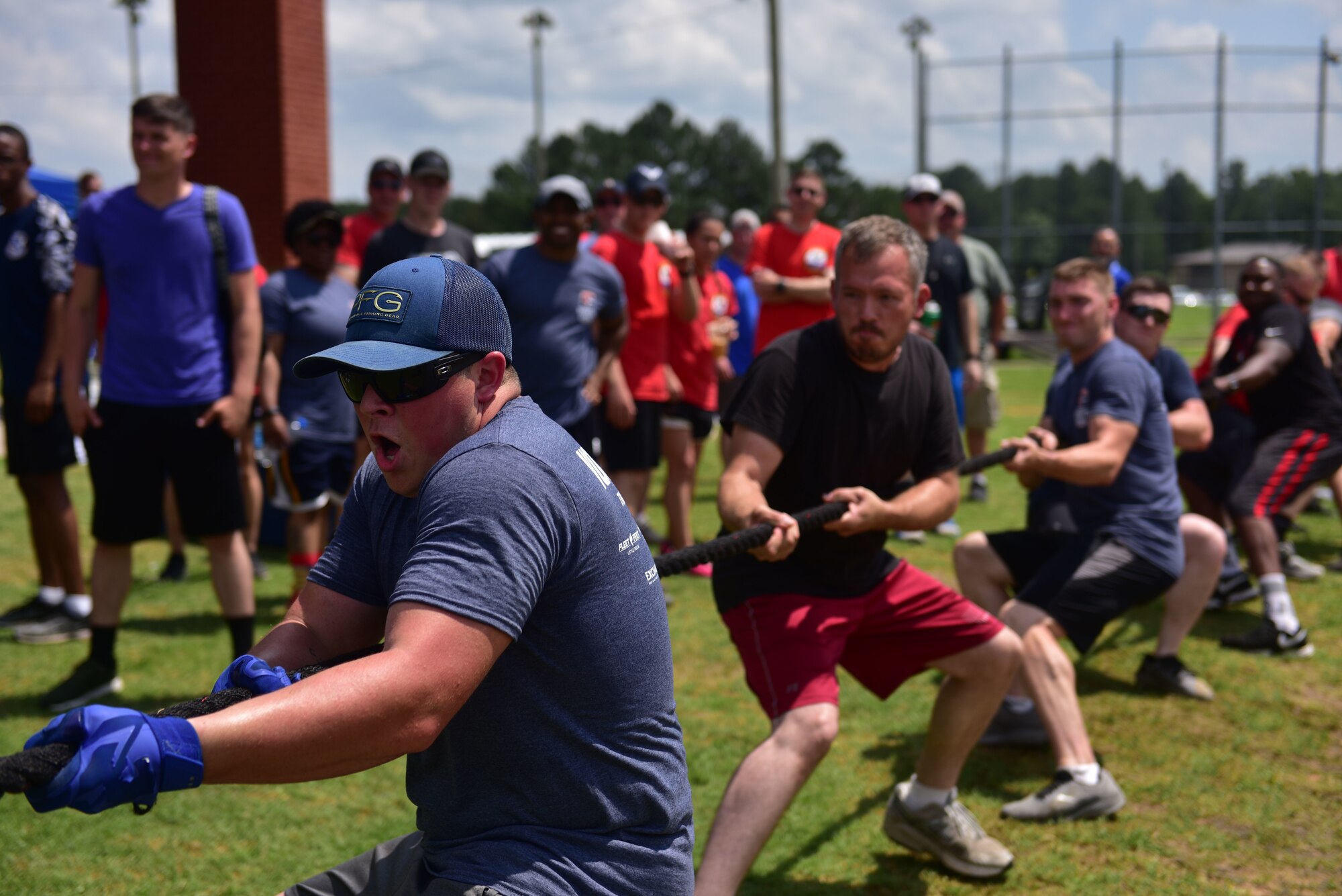 Airmen play tug-of-war during Wingman Day.