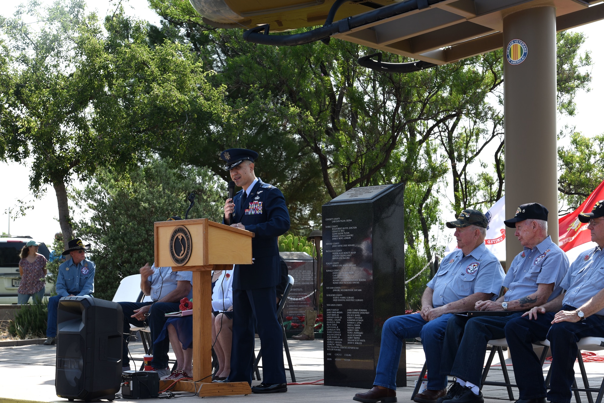 U.S. Air Force Col. Ricky Mills, 17th Training Wing commander, remarks on the significance of Memorial Day at the Concho Valley Vietnam Veterans Memorial Day Ceremony in San Angelo, Texas, May 27, 2019. This memorial features a UH-1 Huey Helicopter displayed in memory of those who served with a special tribute to those who did not return or are still missing from the Vietnam War. (U.S. Air Force photo by Airman 1st Class Zachary Chapman/Released)