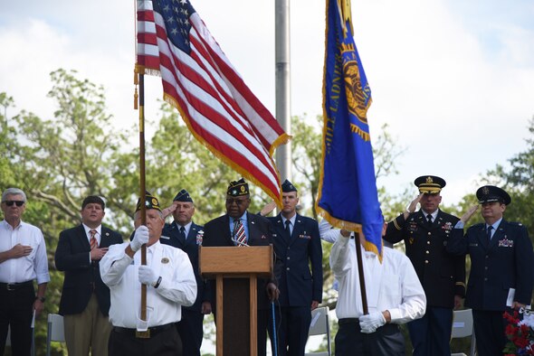 Retired U.S. Air Force Chief Master Sgt. Chris Moore sings the national anthem during the Biloxi National Cemetery Memorial Day Ceremony in Biloxi, Mississippi, May 27, 2019. The ceremony honored those who have made the ultimate sacrifice while serving in the armed forces. Biloxi National Cemetery is the final resting place of more than 23,000 veterans and their family members. Eight hundred burials take place there every year for men and women who served in wars years ago and for those defending America today. (U.S. Air Force photo by Kemberly Groue)