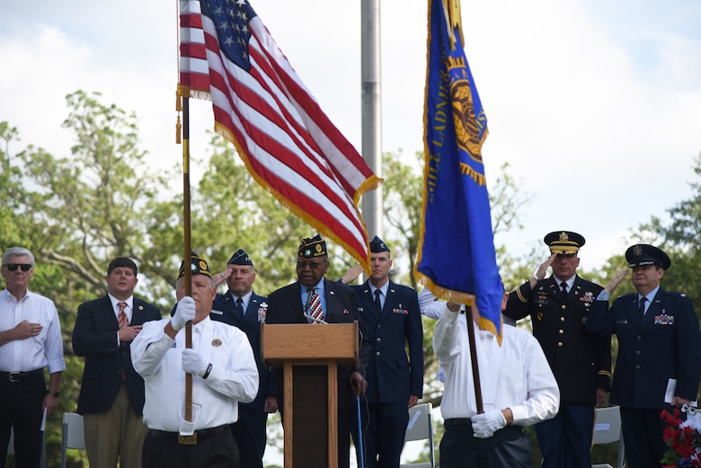 Retired U.S. Air Force Chief Master Sgt. Chris Moore sings the national anthem during the Biloxi National Cemetery Memorial Day Ceremony in Biloxi, Mississippi, May 27, 2019. The ceremony honored those who have made the ultimate sacrifice while serving in the armed forces. Biloxi National Cemetery is the final resting place of more than 23,000 veterans and their family members. Eight hundred burials take place there every year for men and women who served in wars years ago and for those defending America today. (U.S. Air Force photo by Kemberly Groue)