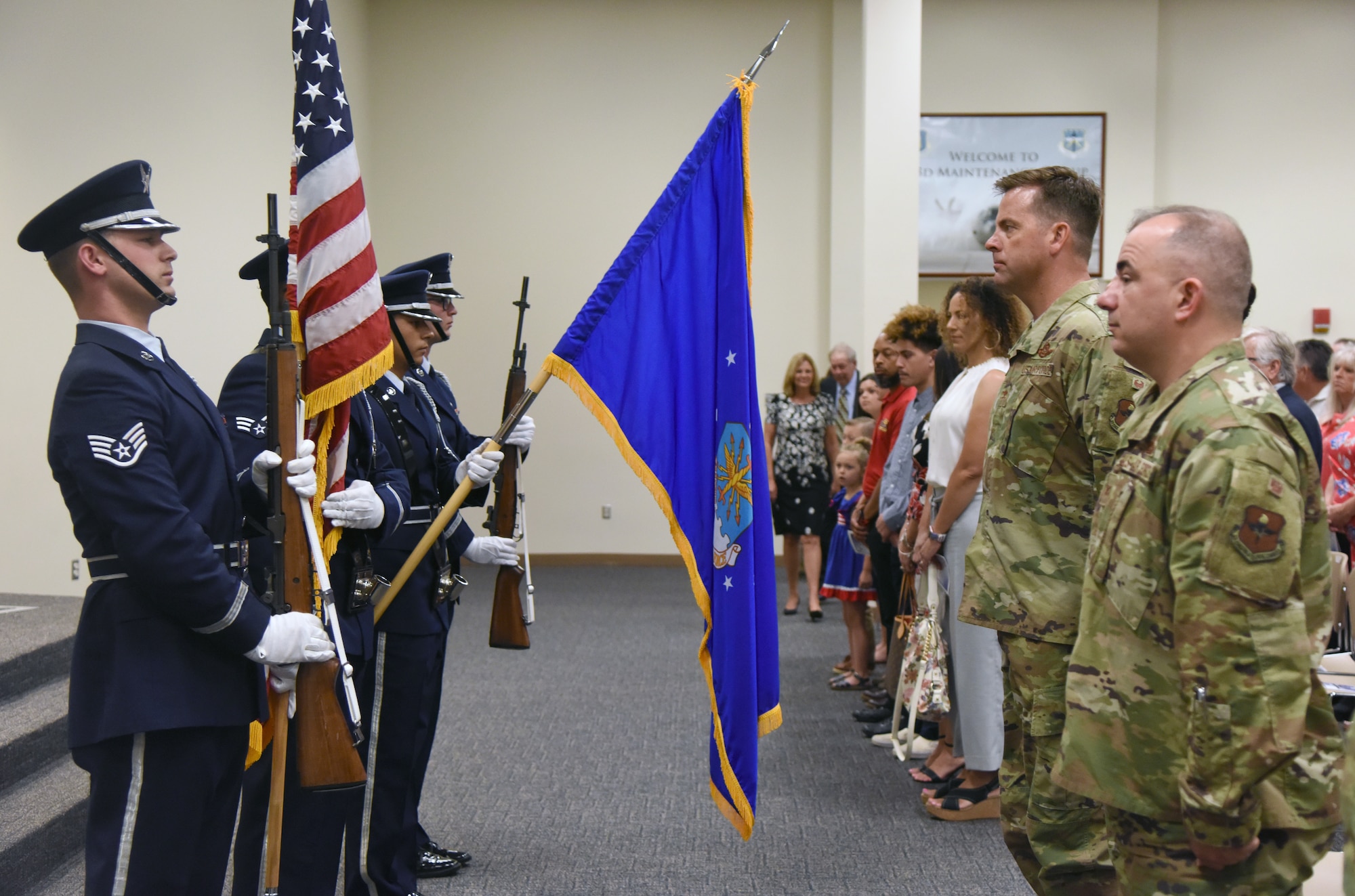 The Keesler Honor Guard presents the colors during the 334th Training Squadron change of command ceremony in the Roberts Consolidated Aircraft Maintenance Facility at Keesler Air Force Base, Mississippi, May 23, 2019. U.S. Air Force Lt. Col. Harry James, incoming 334th TRS commander, assumed command from Lt. Col. Billy Wilson, Jr., outgoing 334th TRS commander, with the passing of the guidon. The passing of the guidon is a ceremonial symbol of exchanging command from one commander to another. (U.S. Air Force photo by Kemberly Groue)