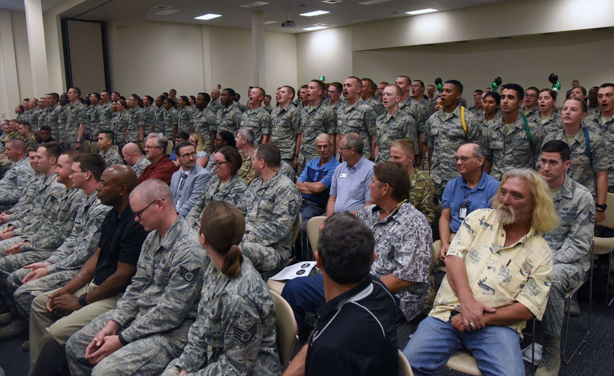 Airmen from the 334th Training Squadron recites the squadron's chant during the 334th TRS change of command ceremony in the Roberts Consolidated Aircraft Maintenance Facility at Keesler Air Force Base, Mississippi, May 23, 2019. U.S. Air Force Lt. Col. Harry James, incoming 334th TRS commander, assumed command from Lt. Col. Billy Wilson, Jr., outgoing 334th TRS commander, with the passing of the guidon. The passing of the guidon is a ceremonial symbol of exchanging command from one commander to another. (U.S. Air Force photo by Kemberly Groue)