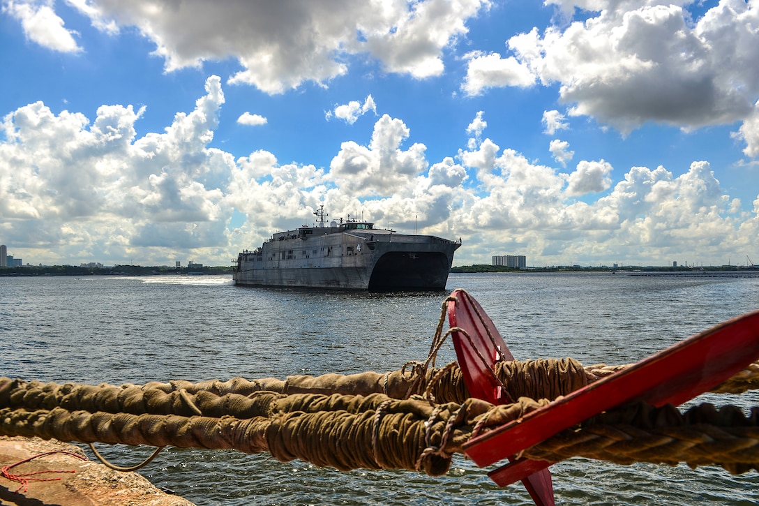 A ship arrives in a port.