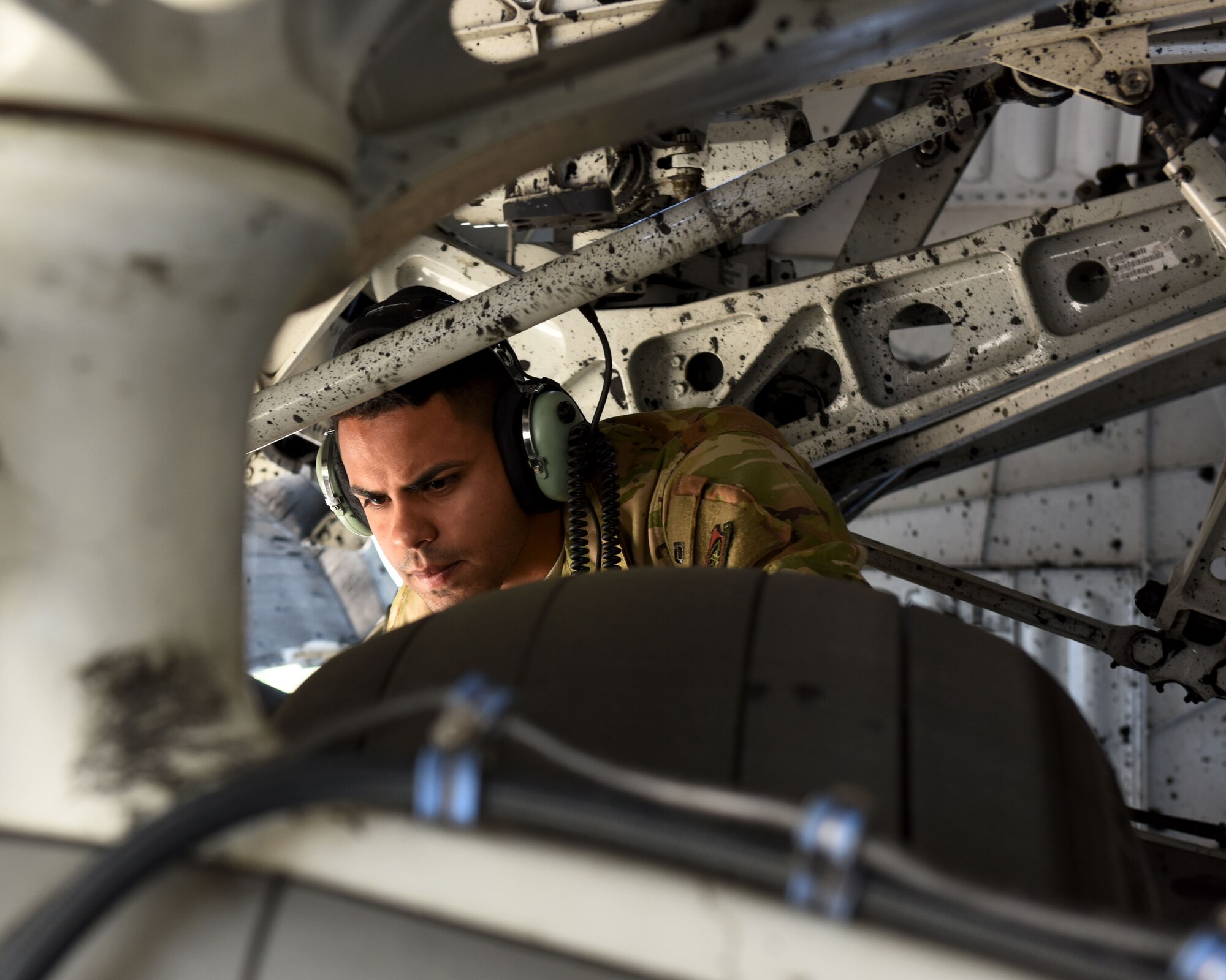 U.S. Air Force Staff Sgt. Andrew Torres-Cosme, 860th Aircraft Maintenance Squadron flying crew chief, checks the tires on a C-17 Globemaster III after landing May 21, 2019, at Pope Army Airfield, North Carolina. The C-17 is capable of rapid strategic delivery of troops and cargo anywhere in the world. (U.S. Air Force photo by 2nd Lt. R. Michael Longoria)