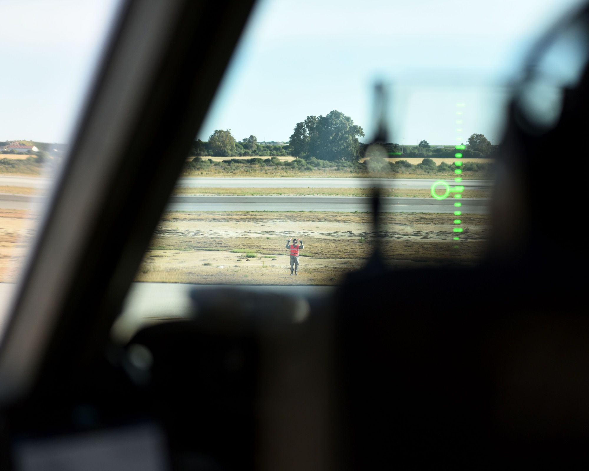 A U.S. Air Force Airman marshals a C-17 Globemaster III from Travis Air Force Base, California, May 19, 2019, at Rota Naval Air Station, Spain. The C-17 is capable of rapid strategic delivery of troops and cargo anywhere in the world. (U.S. Air Force photo by 2nd Lt. R. Michael Longoria)