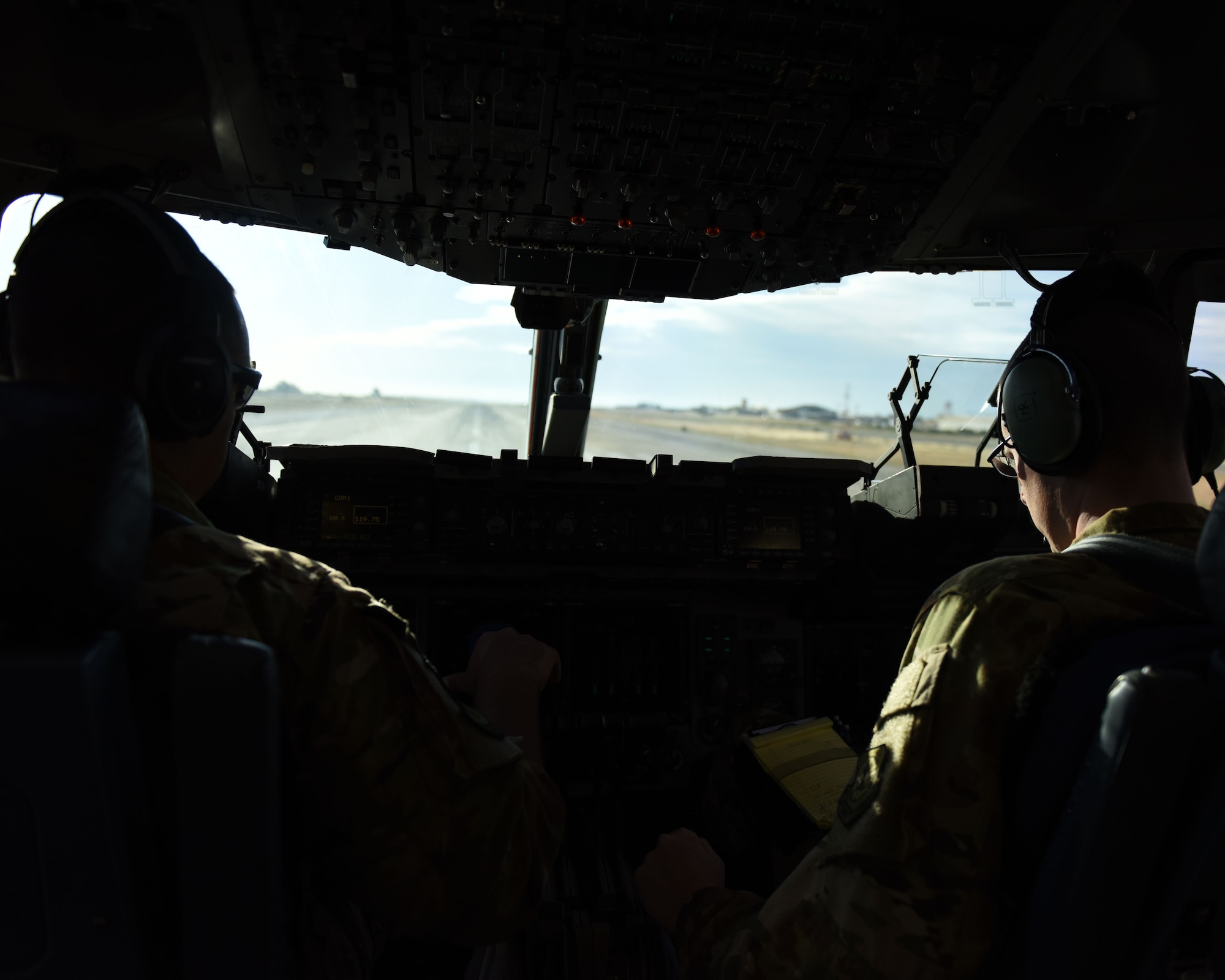 U.S. Air Force Maj. Robert Gates, left, and Capt. Justin Poole, both 21st Airlift Squadron pilots, prepare to take-off in a C-17 Globemaster III May 19, 2019, at Rota Naval Air Station, Spain. The C-17 is capable of rapid strategic delivery of troops and cargo anywhere in the world. (U.S. Air Force photo by 2nd Lt. R. Michael Longoria)
