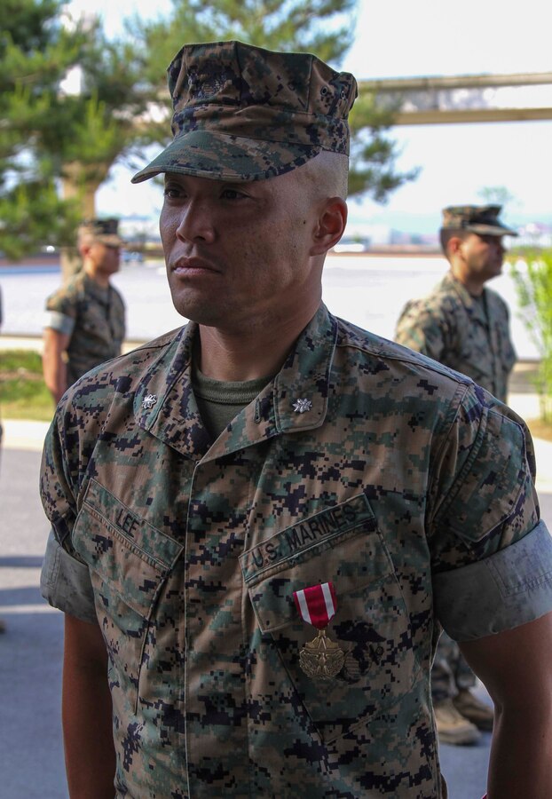 CAMP HUMPHREYS, Republic of Korea – Maj. Gen. Patrick J. Hermesmann, commander of U.S. Marine Corps Forces Korea, awards Lt. Col. Cedric Lee, G6 assistant chief of staff, the Meritorious Service Medal here, 29 May. Lee was awarded the Meritorious Service Medal for dedicating three years of service to MARFORK and the G6, improving the unit’s readiness and communications capabilities at both Camp Humphreys and Camp Mujuk. (Official U.S. Marine Corps photo by Sgt. Nathaniel Hanscom/Released)