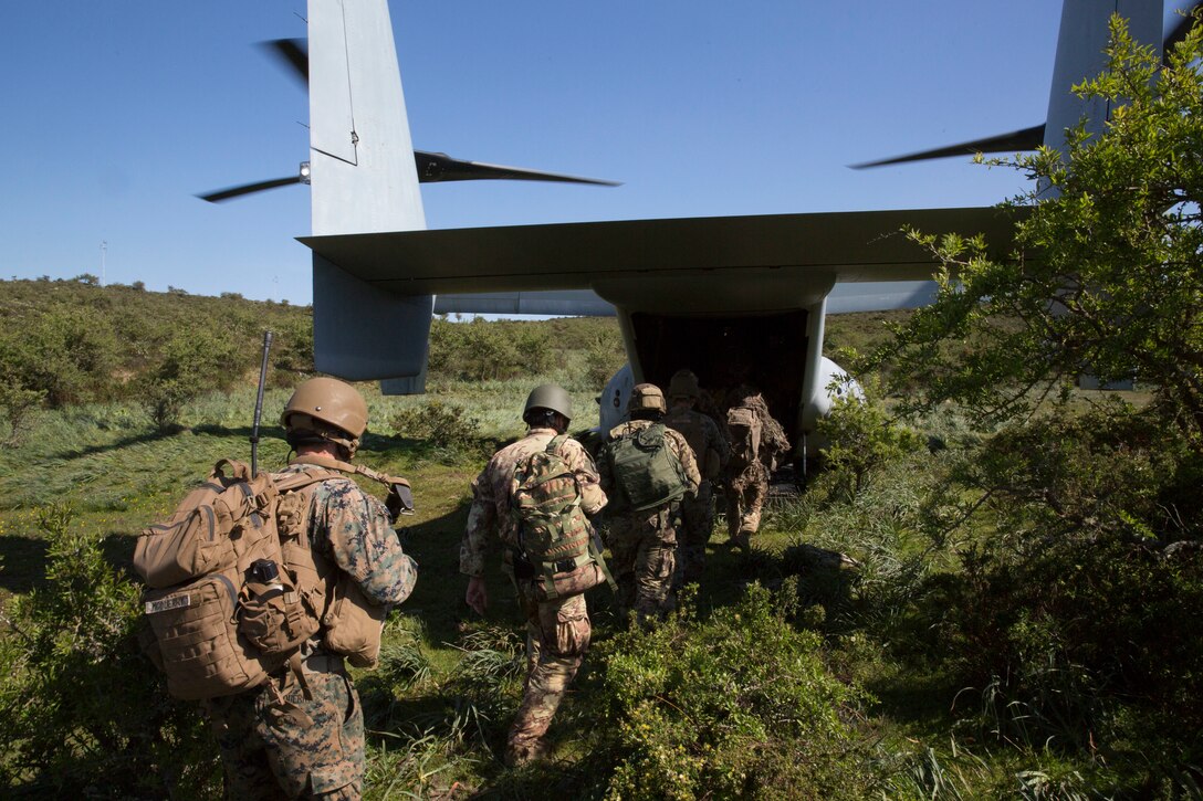 U.S. Marines with Special Purpose Marine Air-Ground Task Force-Crisis Response-Africa 19.2, Marine Forces Europe and Africa, and members of the Italian military board a U.S. Marine Corps MV-22B Osprey while conducting a raid rehearsal during exercise Joint Stars 2019 at Perdas range in Sardinia, Italy, May 24, 2019. Joint Stars 2019 is a bilateral training exercise between the Italian Armed Forces and U.S. Marines. SPMAGTF-CR-AF is deployed to conduct crisis-response and theater-security operations in Africa and promote regional stability by conducting military-to-military training exercises throughout Europe and Africa. (U.S. Marine Corps photo by Staff Sgt. Mark E. Morrow Jr.)