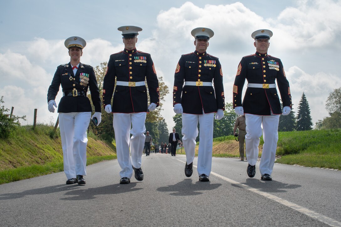 U.S. Marines with Marine Forces Europe and Africa walk to the wreath-laying ceremony at the German World War I cemetery near Belleau, France, May 26, 2019. The ceremony was held in commemoration of the 101st anniversary of the battle of Belleau Wood, conducted to honor all service members who paid the ultimate sacrifice during World War I. (U.S. Marine Corps photo by Lance Cpl. Menelik Collins)