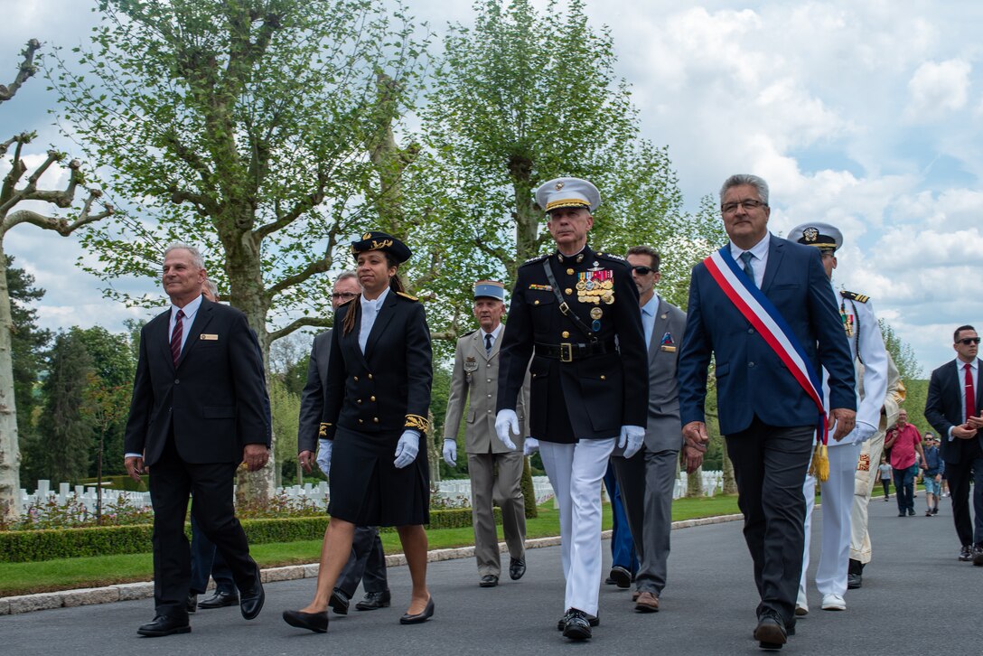 U.S. Marine Corps Gen. Thomas D. Waldhauser, the commander of U.S. Africa Command, and distinguished guests march during the Memorial Day ceremony at the Oise-Aisne American Cemetery near Seringes-et-Nesles, France, May 26, 2019. The memorial was held in commemoration of the 101st anniversary of the battle of Belleau Wood, conducted to honor the legacy of service members who gave their lives in defense of the United States and European allies. (U.S. Marine Corps photo by Lance Cpl. Menelik Collins)