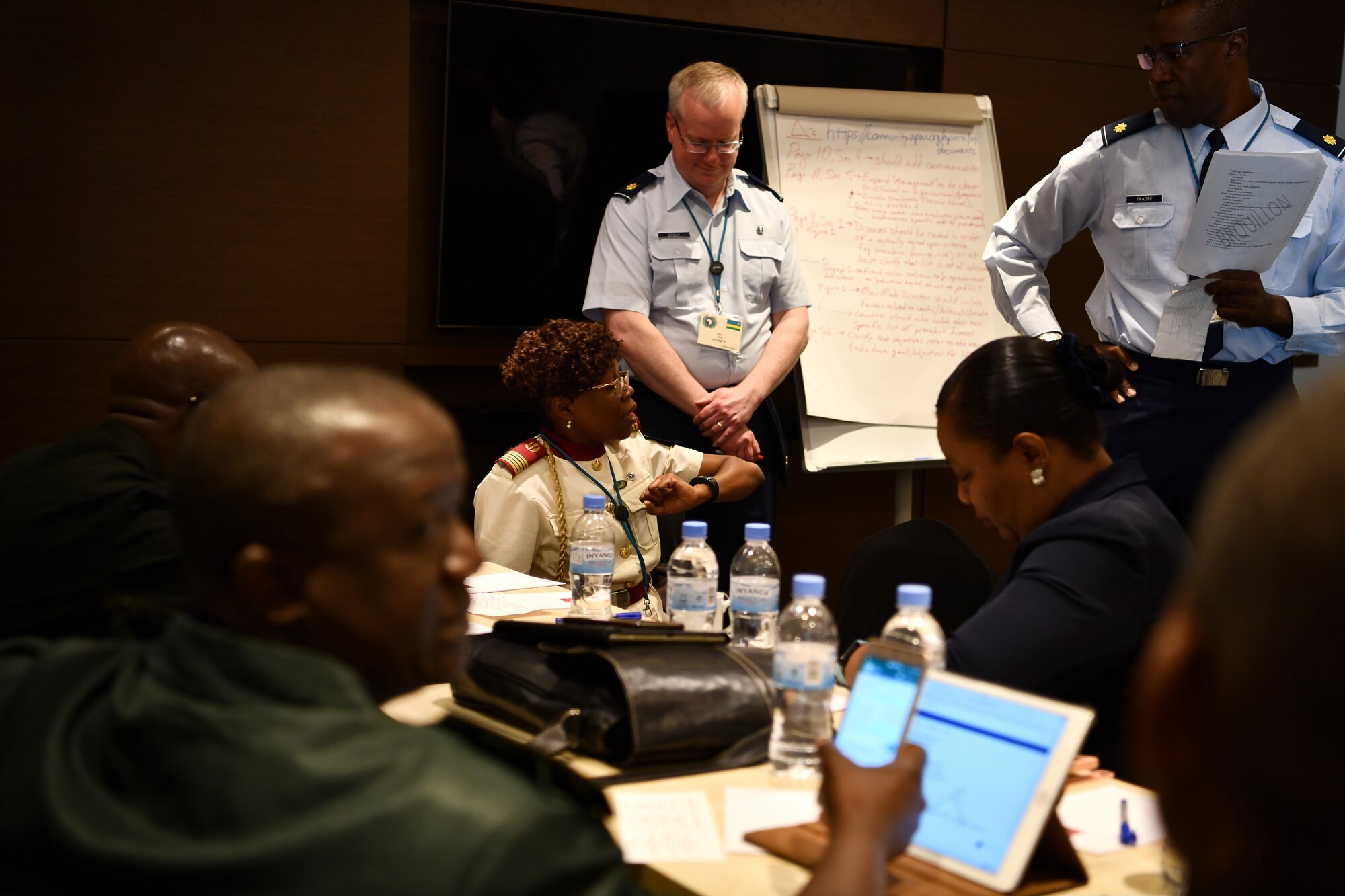 U.S. Air Force Maj. Malick Traore, an international health specialist, advances discussions for one of the break out groups during the African Partner Outbreak Response Alliance (APORA) conference in Kigali, Rwanda on May 21, 2019. These break out groups focused on various subjects to include early warning and surveillance measures, logistical planning and preparedness. During APORA, military and civilian leaders worked together to align best practices and improve response capabilities for potential outbreaks of contagious diseases. The training helped bolster relationships with current partners and mobilize new partners to strengthen pandemic prevention programs. (U.S. Air Force photo by Master Sgt. Andy M. Kin)