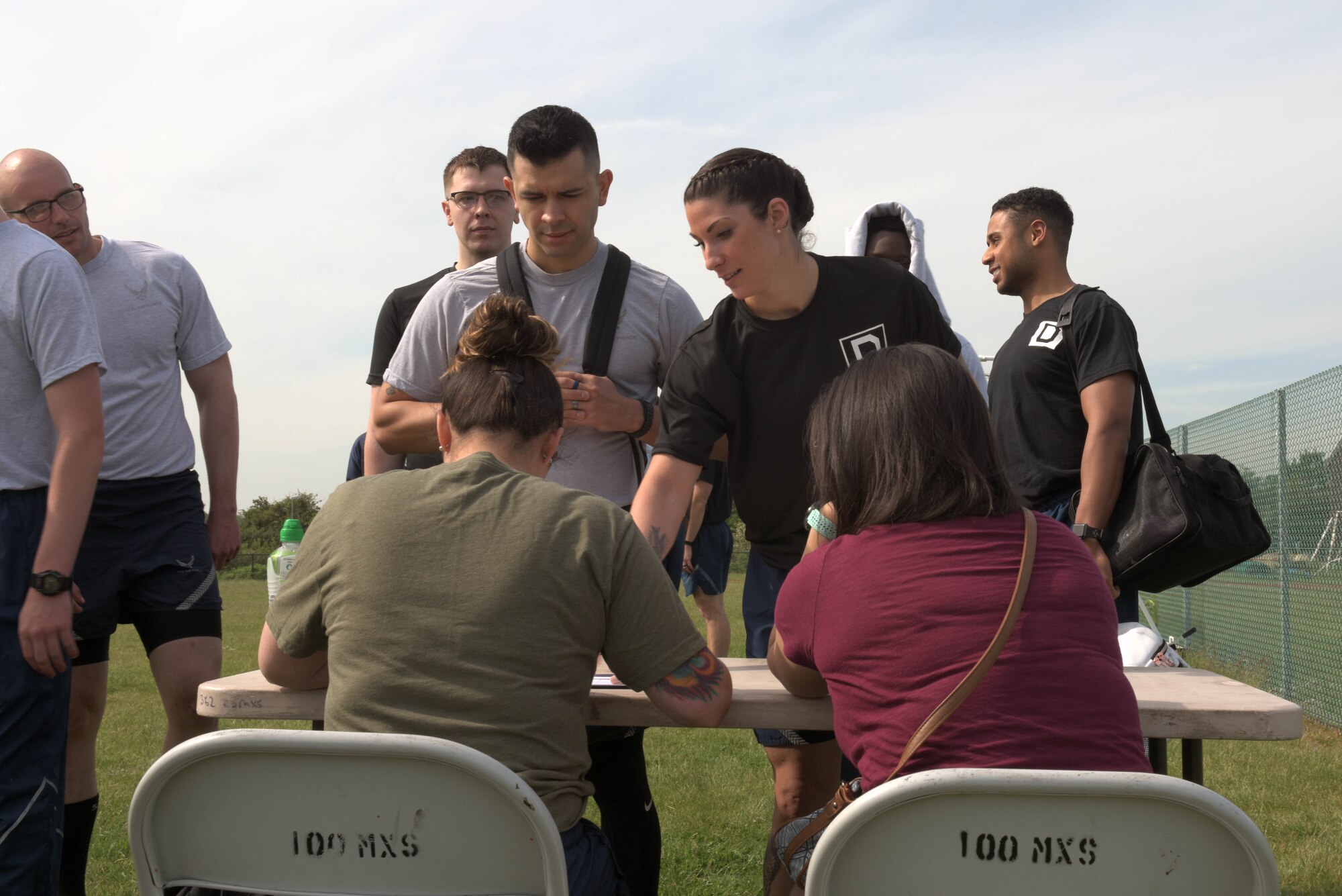 Airmen assigned to the 100th Air Refueling Wing, RAF Mildenhall, England, sign-up for the Highland Games at RAF Mildenhall, May 23, 2019. This was the first year that the 100th ARW hosted the Highland Games. (U.S. Air Force photo by Senior Airman Benjamin Cooper)