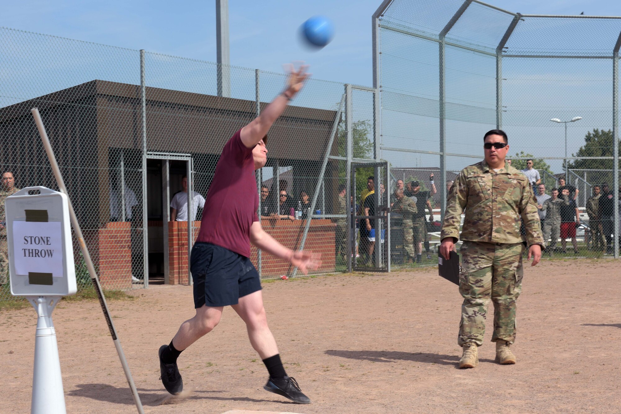 U.S. Air Force Senior Airman Edgar Montano, 100th Security Forces Squadron response force leader, performs the stone throw event during the Highland Games at RAF Mildenhall, England, May 23, 2019. The stone throw was judged by the overall distance it was thrown. (U.S. Air Force photo by Senior Airman Benjamin Cooper)