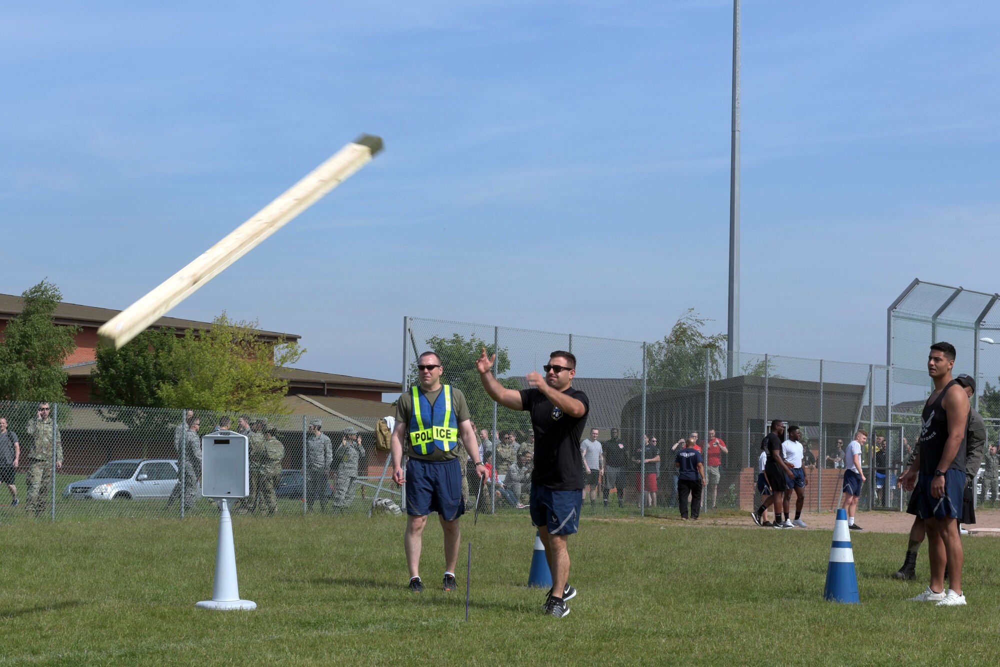 U.S. Air Force Airman 1st Class Anthony Chandler, 100th Security Forces Squadron response force leader, performs the caber toss during the Highland Games at RAF Mildenhall, England, May 23, 2019. The Highland Games consisted of five events: stone throw, caber toss, hammer throw, 400 meter relay race and jerry can relay. (U.S. Air Force photo by Senior Airman Benjamin Cooper)