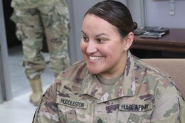 Sgt. Ruthie Huddleston, 450th Transportation Battalion, talks to Soldiers at Holy Joe's, a resiliency center at Camp Arifjan, Kuwait, May 20, 2019.