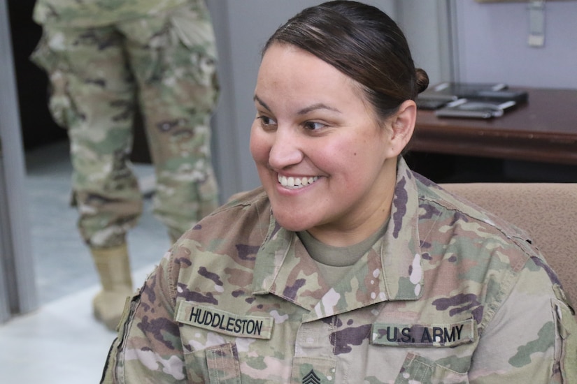 Sgt. Ruthie Huddleston, 450th Transportation Battalion, talks to Soldiers at Holy Joe's, a resiliency center at Camp Arifjan, Kuwait, May 20, 2019.