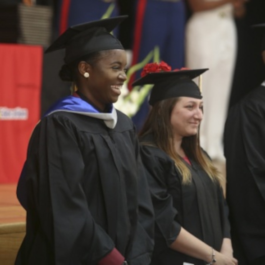 Cpl. Kylaine Rogers stands with her fellow graduates at her graduation aboard Marine Corps Recruit Depot Parris Island, May 17. Rogers graduated from Embry-Riddle Aeronautical University with her Master's degree in aeronautics.