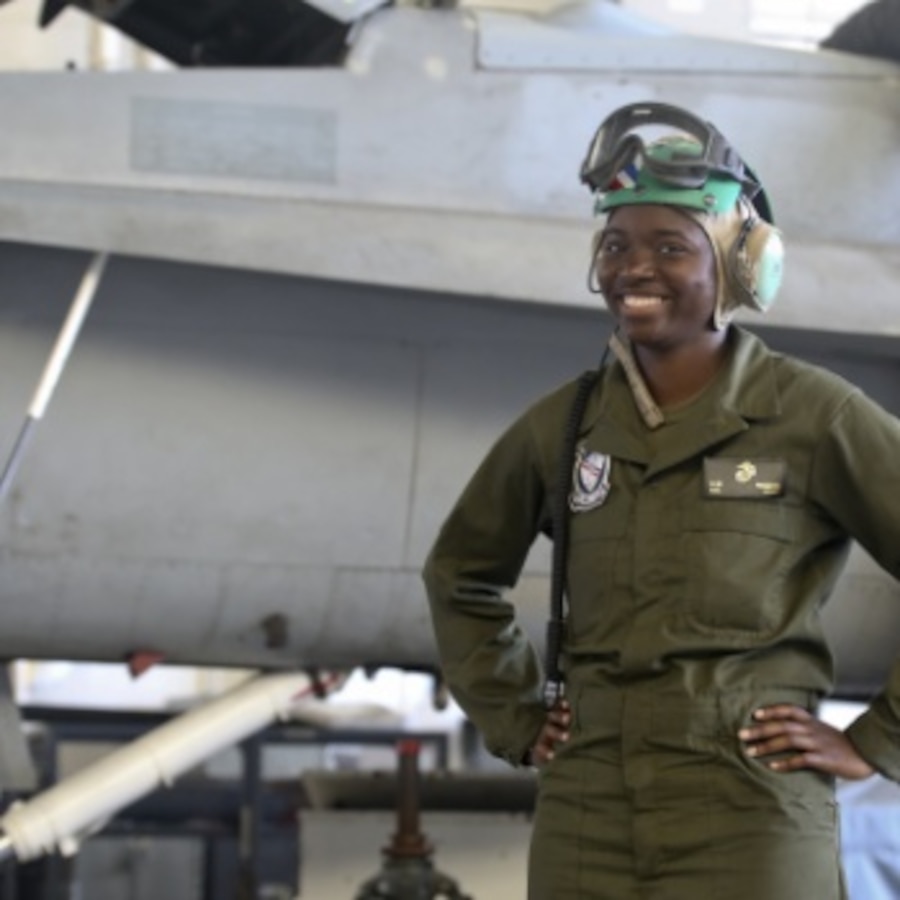 Cpl. Kylaine Rogers poses for a photo in front of an aircraft in Marine Fighter Attack Squadron-115's hangar aboard Marine Corps Air Station Beaufort, May 29. Rogers is an avionics technician with VMFA-115.
