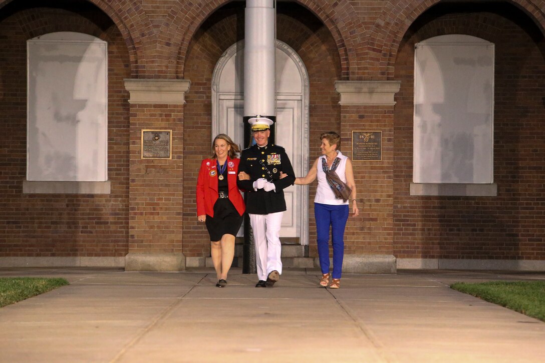 General Joseph F. Dunford, Chairman of the Joint Chiefs of Staff, accompanied by his wife, Ellyn Dunford and Ms. Bonnie Carrol, president and founder of the Tragedy Assistance Program, walk down Center Walk during a Friday Evening Parade at Marine Barracks Washington, D.C., May 5, 2019. The hosting official for the evening was the 19th Chairman of the Joint Chiefs of Staff, Gen. Joseph F. Dunford, and the guest of honor was Ms. Bonnie Carroll, the president and founder of the Tragedy Assistance Program for Survivors and 2015 Presidential Medal of Freedom recipient. (U.S. Marine Corps photo by Pfc. Allen Sanders)
