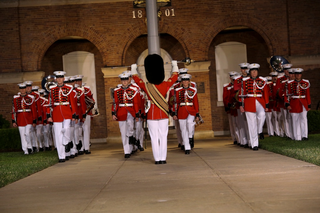 Marines with the “The President’s Own,” U.S. Marine Band march down Center Walk during a Friday Evening Parade at Marine Barracks Washington, D.C., May 5, 2019. The hosting official for the evening was the 19th Chairman of the Joint Chiefs of Staff Gen. Joseph F. Dunford, and the guest of honor was Ms. Bonnie Carroll, the president and founder of the Tragedy Assistance Program for Survivors and 2015 Presidential Medal of Freedom recipient. (U.S. Marine Corps photo by Pfc. Allen Sanders)