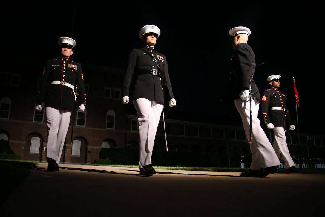 Marine with the Marine Barracks Washington D.C. parade marching staff march down Center Walk during a Friday Evening Parade at the Barracks, May 5, 2019. The hosting official for the evening was the 19th Chairman of the Joint Chiefs of Staff Gen. Joseph F. Dunford, and the guest of honor was Ms. Bonnie Carroll, the president and founder of the Tragedy Assistance Program for Survivors and 2015 Presidential Medal of Freedom recipient.