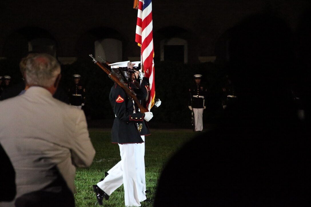 Marines with the U.S. Marine Corps Color Guard march across the parade deck during a Friday Evening Parade at Marine Barracks Washington, D.C., May 5, 2019. The hosting official for the evening was the 19th Chairman of the Joint Chiefs of Staff Gen. Joseph F. Dunford, and the guest of honor was Ms. Bonnie Carroll, the president and founder of the Tragedy Assistance Program for Survivors and 2015 Presidential Medal of Freedom recipient.