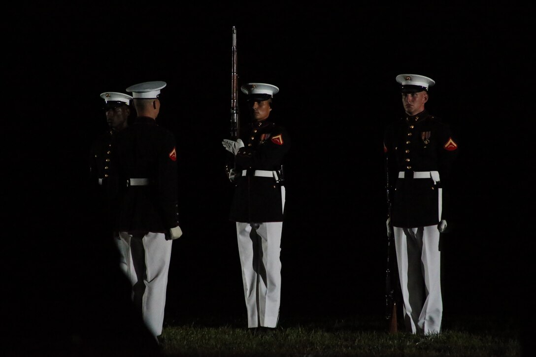 Marines with the U.S. Marine Corps Silent Drill Platoon execute their “long line” sequence during a Friday Evening Parade at Marine Barracks Washington, D.C., May 5, 2019. The hosting official for the evening was the 19th Chairman of the Joint Chiefs of Staff Gen. Joseph F. Dunford, and the guest of honor was Ms. Bonnie Carroll, the president and founder of the Tragedy Assistance Program for Survivors and 2015 Presidential Medal of Freedom recipient.