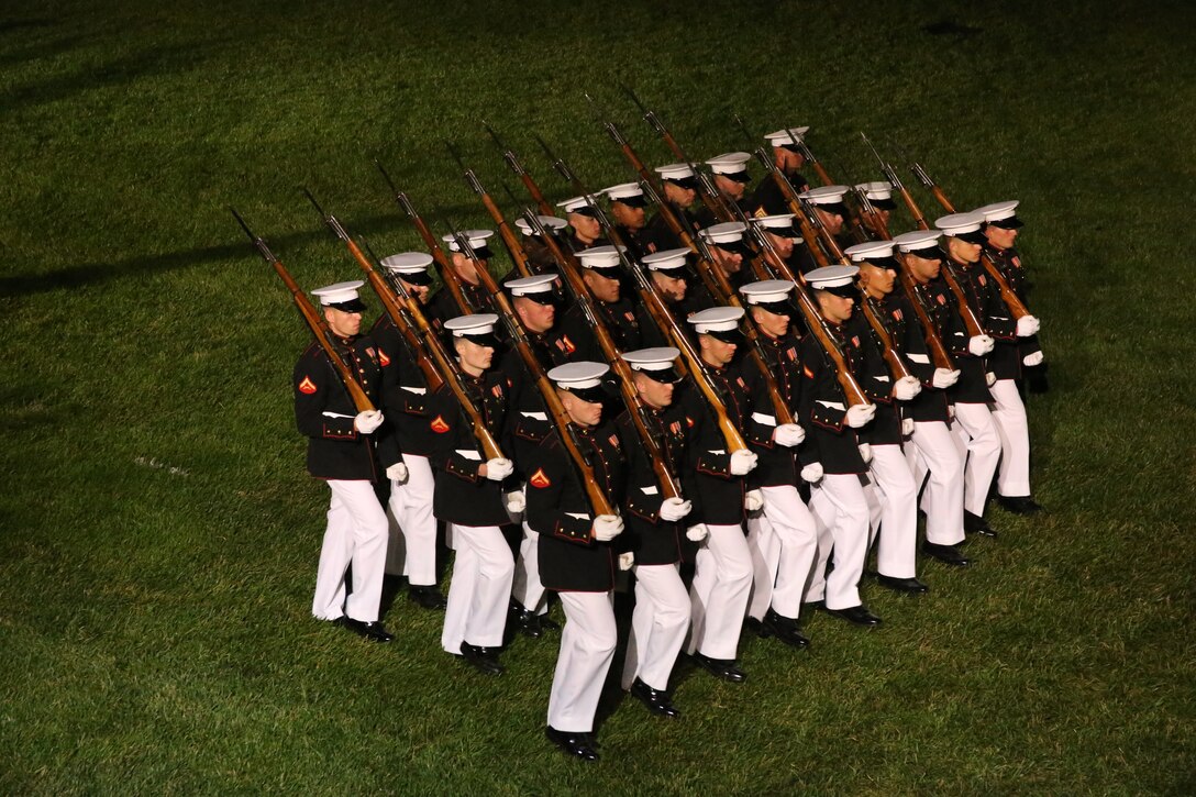 Marines with Marine Barracks Washington D.C. march across the parade deck for “pass in review” during a Friday Evening Parade at the Barracks, May 5, 2019. The hosting official for the evening was the 19th Chairman of the Joint Chiefs of Staff Gen. Joseph F. Dunford, and the guest of honor was Ms. Bonnie Carroll, the president and founder of the Tragedy Assistance Program for Survivors and 2015 Presidential Medal of Freedom recipient.