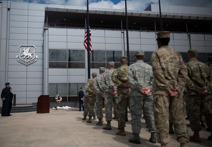 Airmen stand in formation at parade rest during a retreat ceremony honoring Senior Master Sgt. Harold Mosley at Schriever Air Force Base, Colorado, May 22, 2019. Mosley’s widow, Amanda, was in attendance and laid a wreath in honor of her husband during the ceremony. (U.S. Air Force photo by Airman Jonathan Whitely)