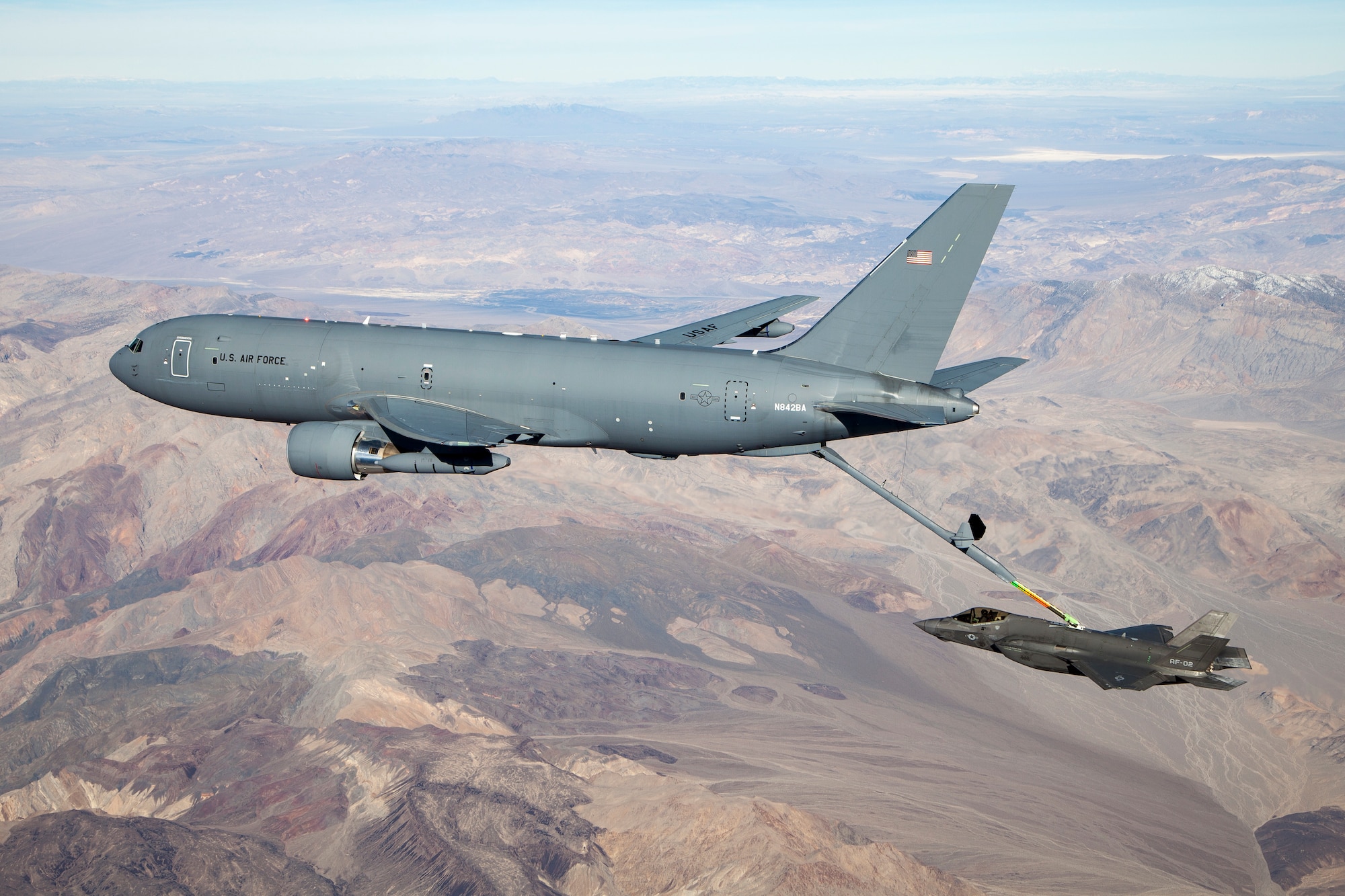 A KC-46A Pegasus connects with an F-35 Lightning II in the skies over California Jan. 22, 2019.  The Air Force confirmed the selection of Wright-Patterson AFB, Ohio to host the F-35 Hybrid Product Support Integrator Organization May 29. (U.S. Air Force photo by Ethan Wagner)
